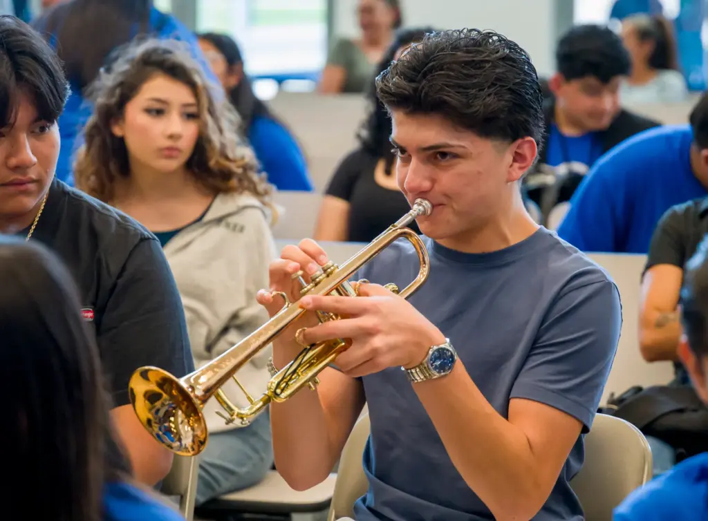 Master class trumpet player, Pedro Fregoso, center, plays a few...