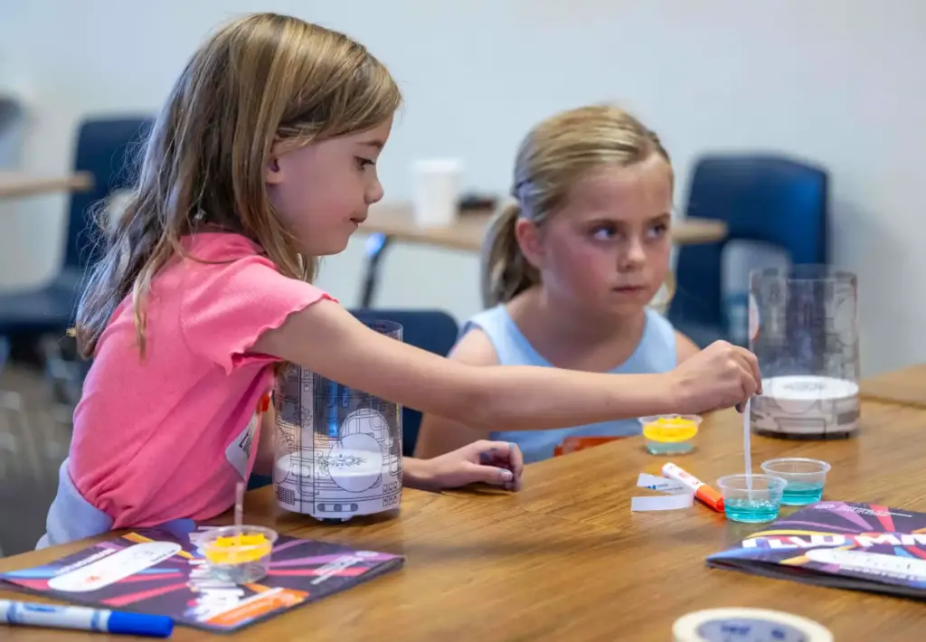 Ellie Schaeffer, 5, of Ladera Ranch uses a pipette to...