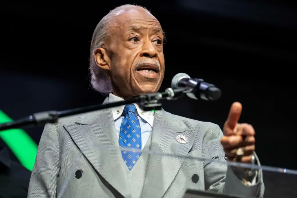 The Rev. Al Sharpton speaks during a news conference with Christine and Elmore Wonsley.
