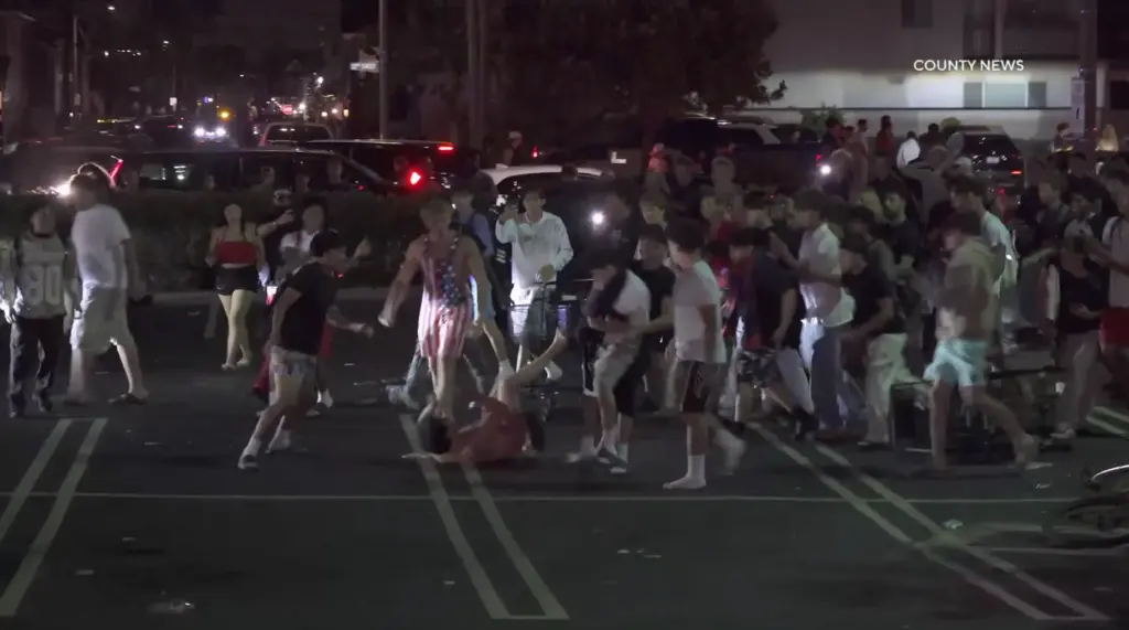 A man kicks another man in the Pavilionâs parking lot...