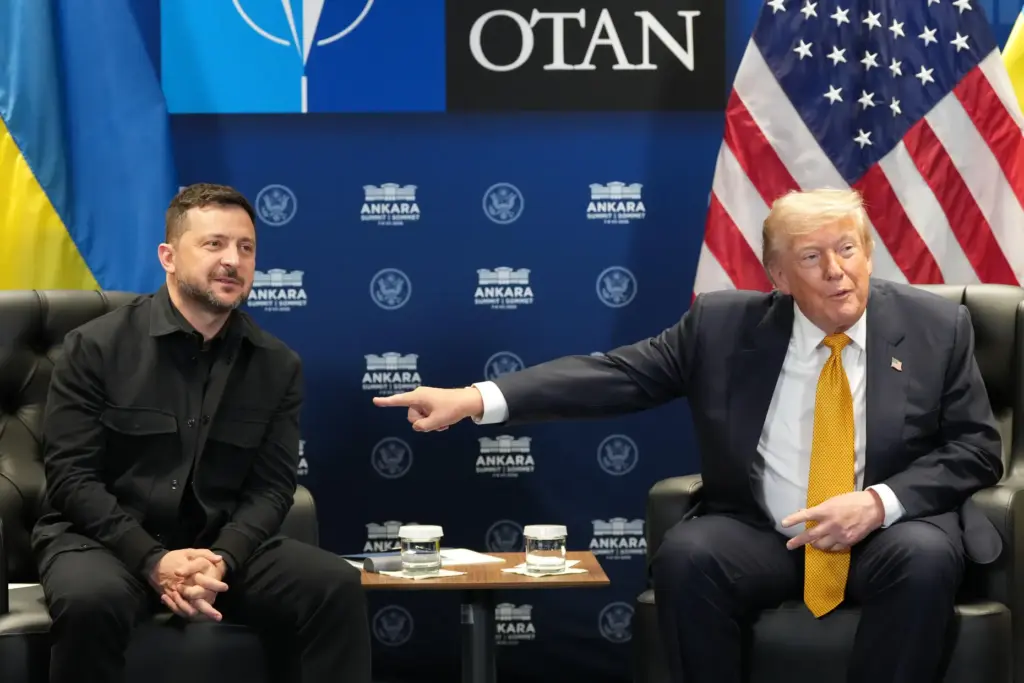 President Donald Trump points at Ukraine's President Volodymyr Zelenskyy.