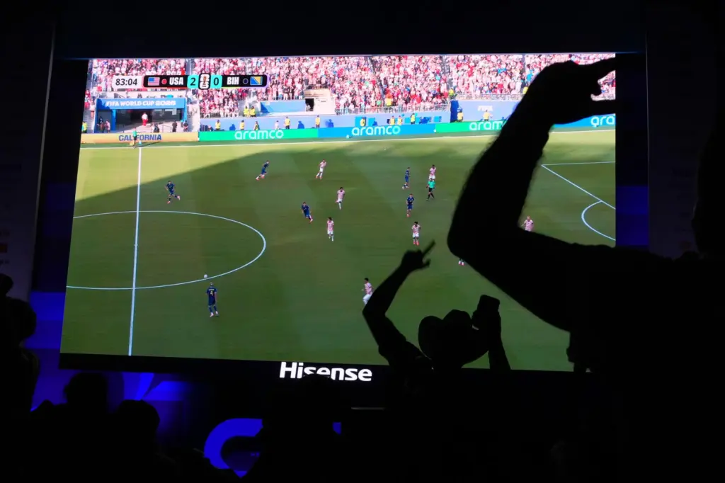 Soccer fans celebrate the U.S. scoring its second goal against Bosnia.