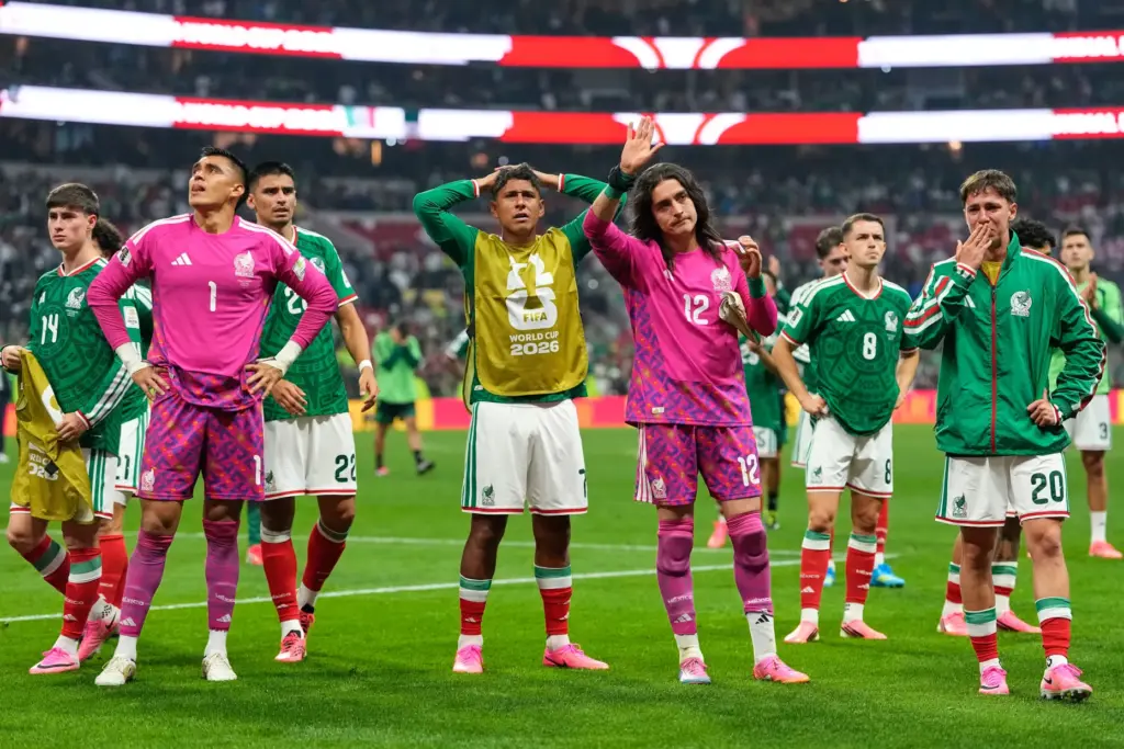 Mexico players react following the World Cup round of 16...