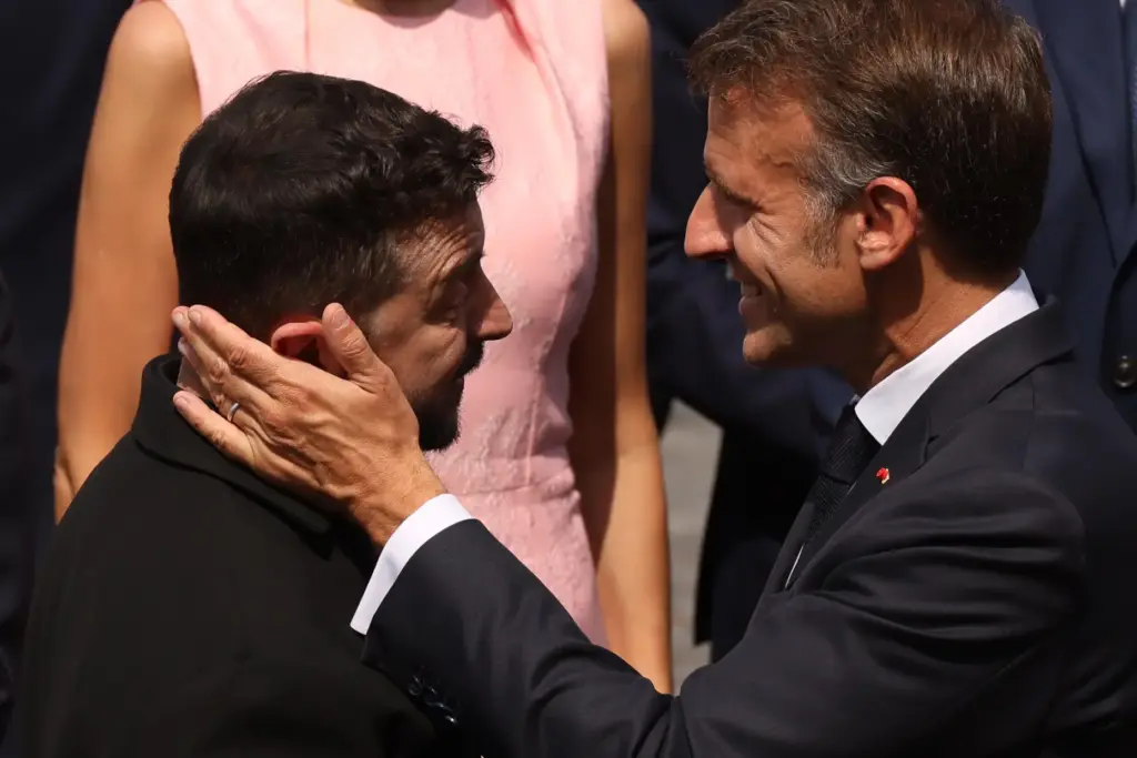 French President Emmanuel Macron speaks with Ukraine's President Volodymyr Zelensky.