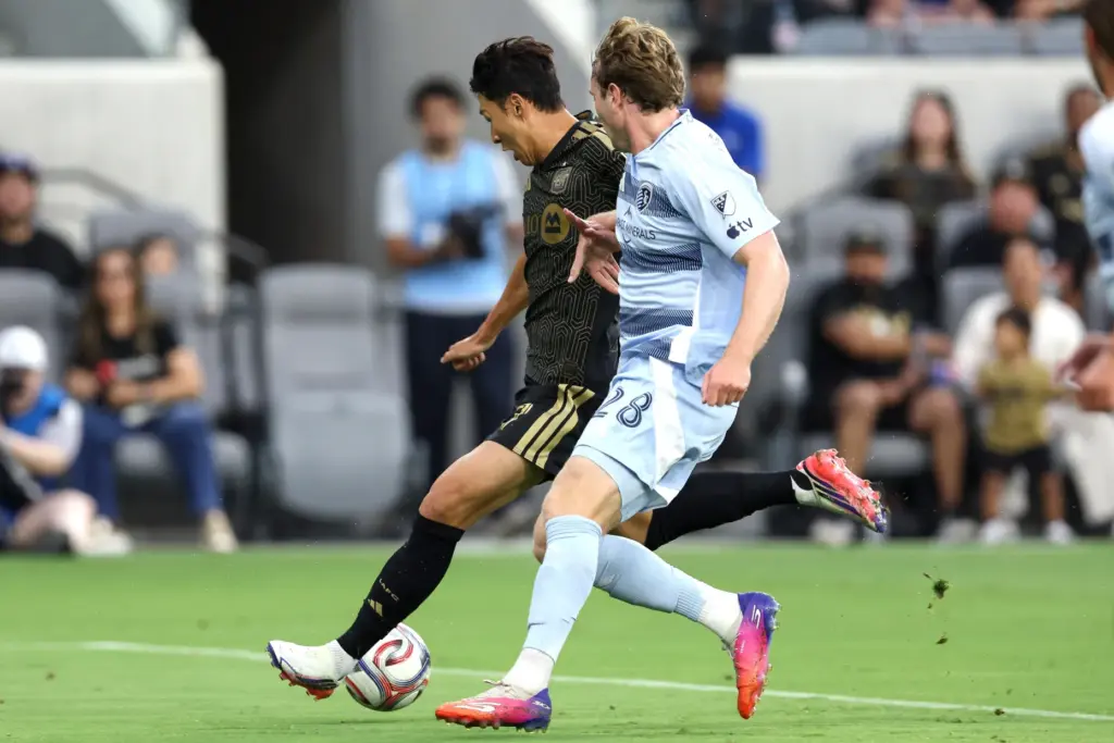 Los Angeles FC forward Son Heung-Min, left, winds up to...