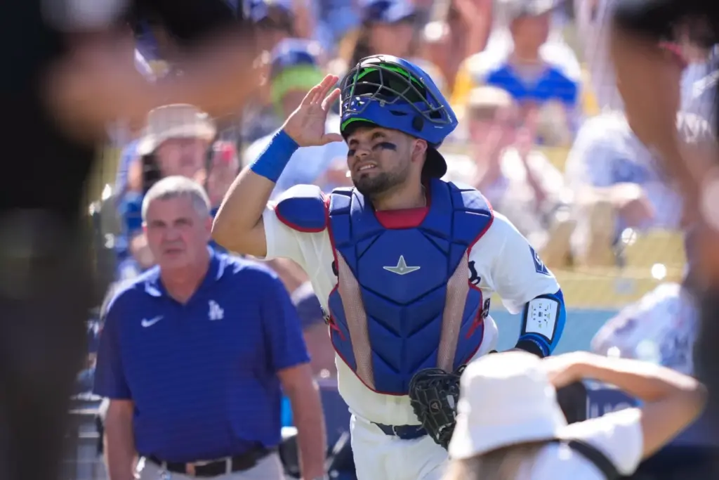 Dodgers catcher Eliezer Alfonzo looks toward the sky as he...