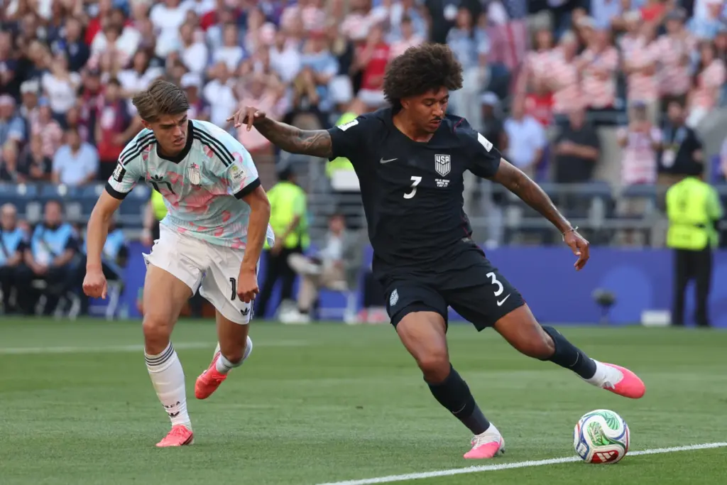 United States’ Chris Richards (3) plays the ball past Belgium’s...