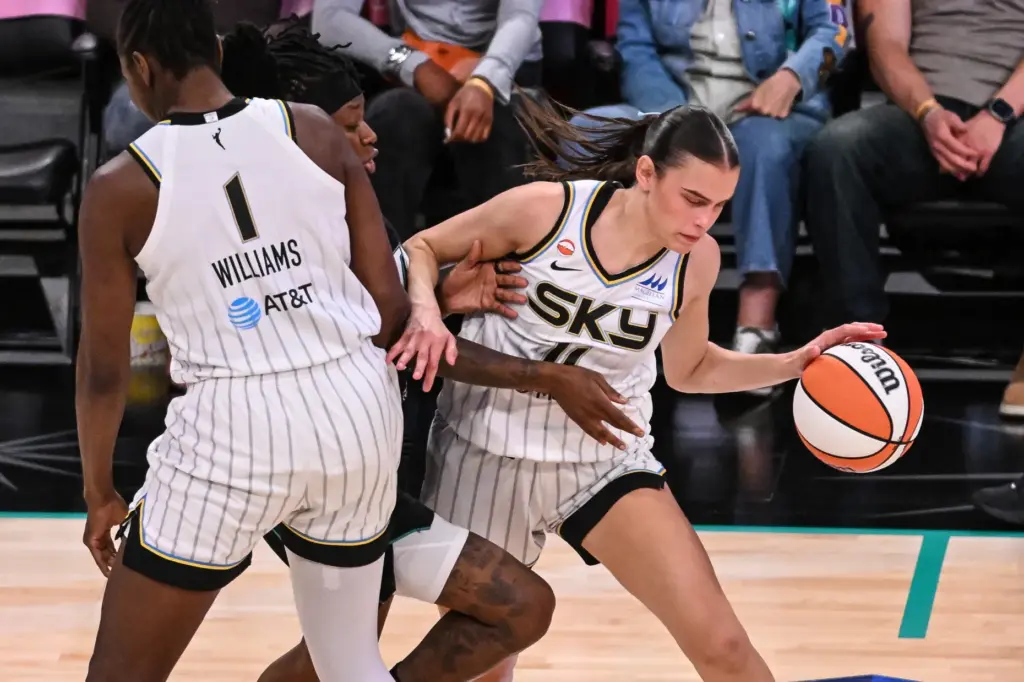 Chicago Sky rookie Gabriela Jaquez, right, handles the ball as...