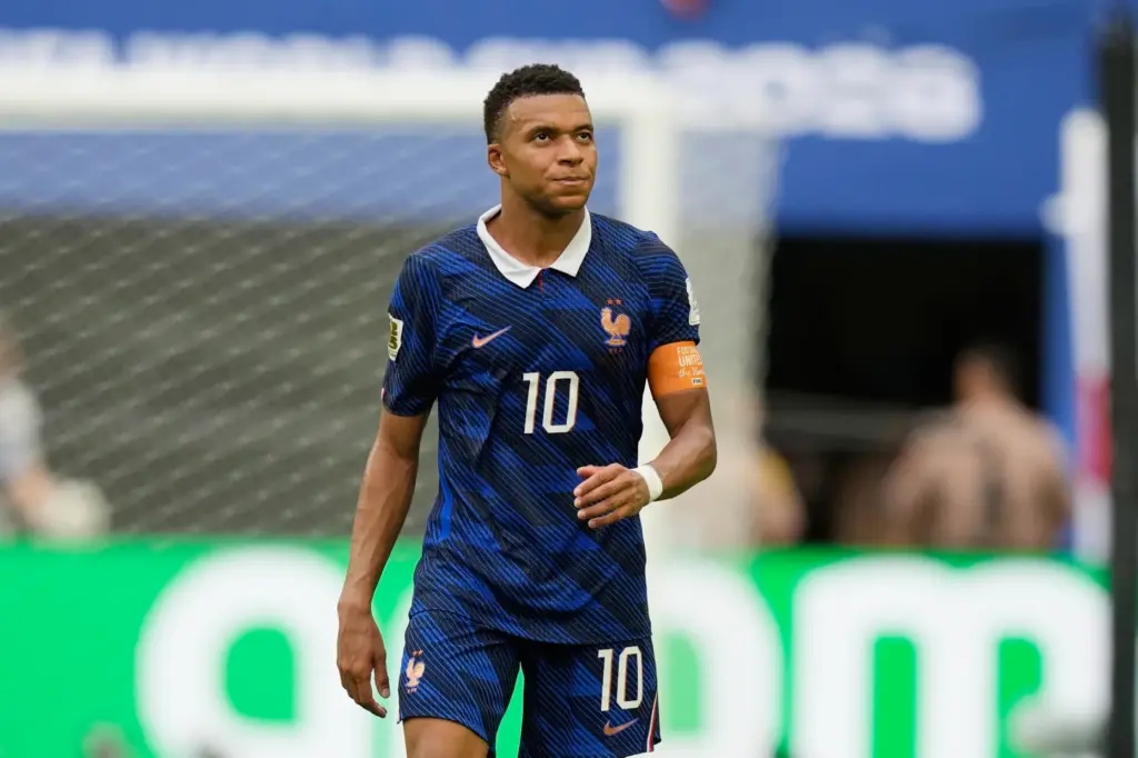 France’s Kylian Mbappe (10) walks off the pttch after the...