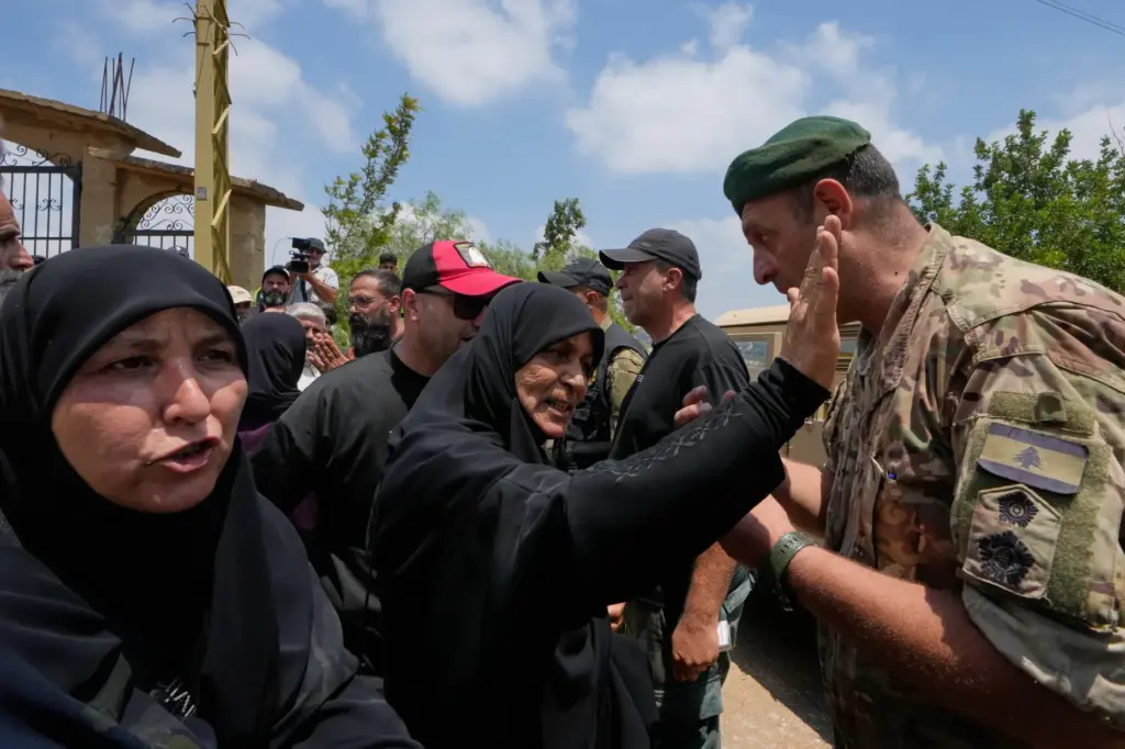 Lebanese army soldiers prevent residents from entering the southern village of Zawtar al-Gharbiyeh.