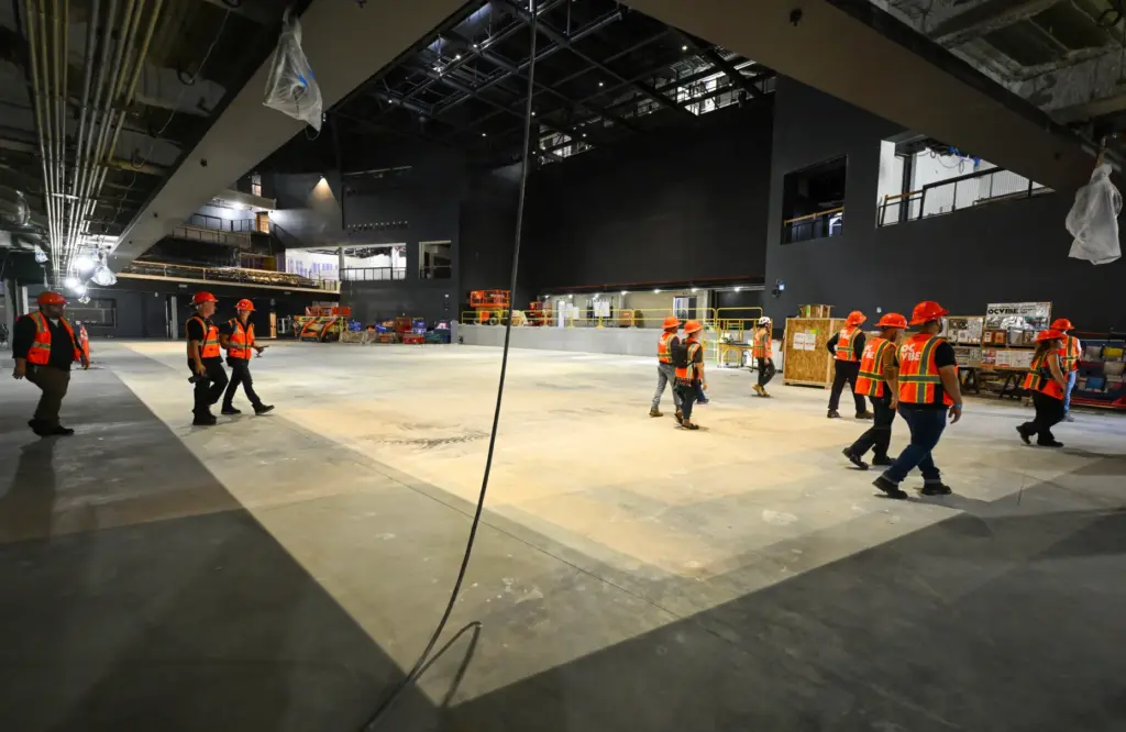 Visitors tour construction at the new concert hall at OC...