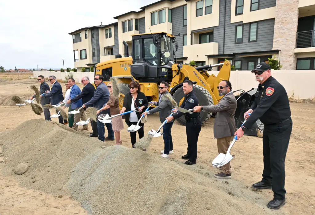 Mayor Ashleigh Aitken, center, joins other officials as they ceremonially...