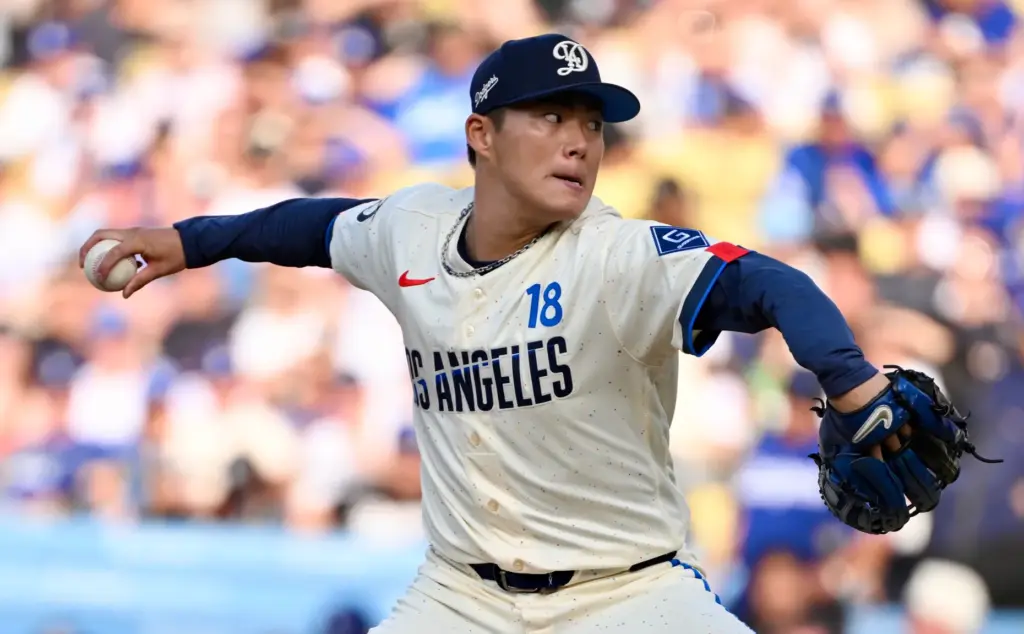 Starting pitcher Yoshinobu Yamamoto of the Dodgers throws to the...
