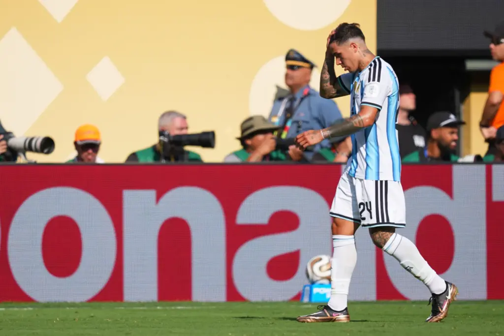 Argentina’s Enzo Fernandez (24) leaves the field after a red...