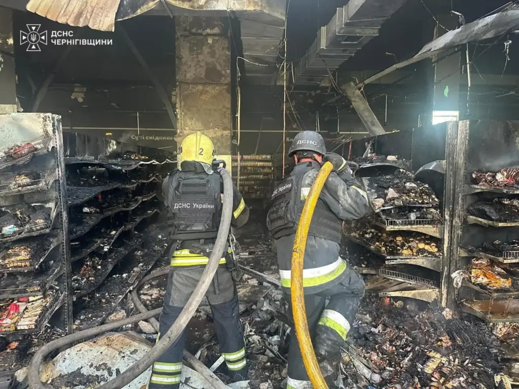 Firefighters put out a fire in a supermarket following a Russian drone attack in Chernihiv, Ukraine.
