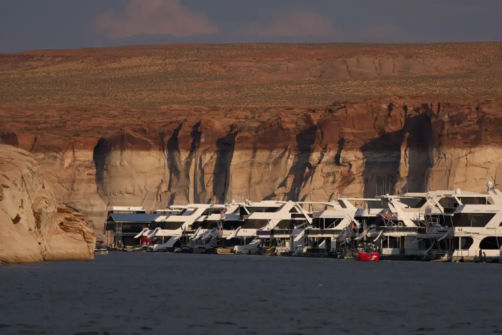 Houseboats are moored at the Antelope Point Marina on Lake...