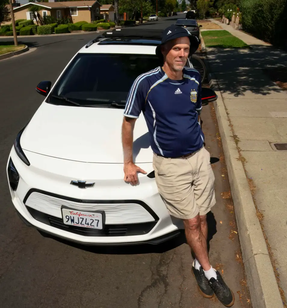 Tim Tipping with his 2023 Chevrolet Bolt EV in Claremont...