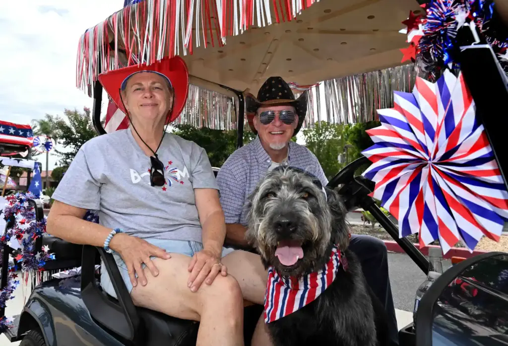 Esther Borgess, left, and Shane Borgess with their dog, Soda...