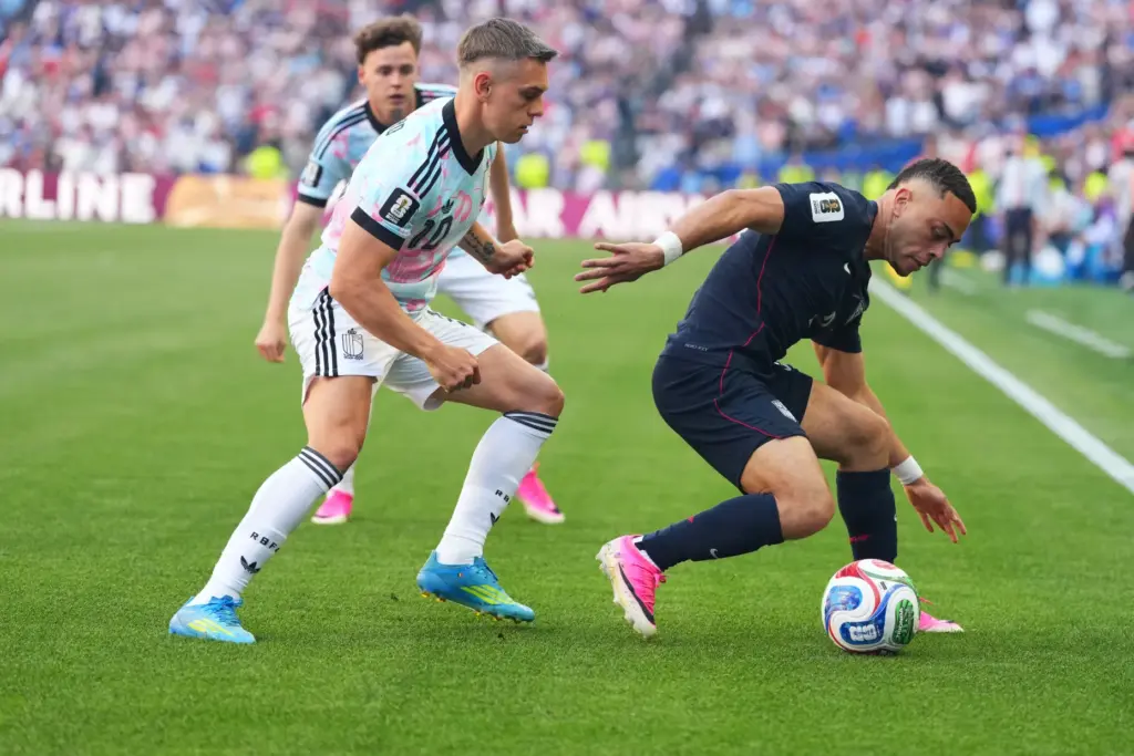United States’ Sergino Dest, right, controls a ball chased by...