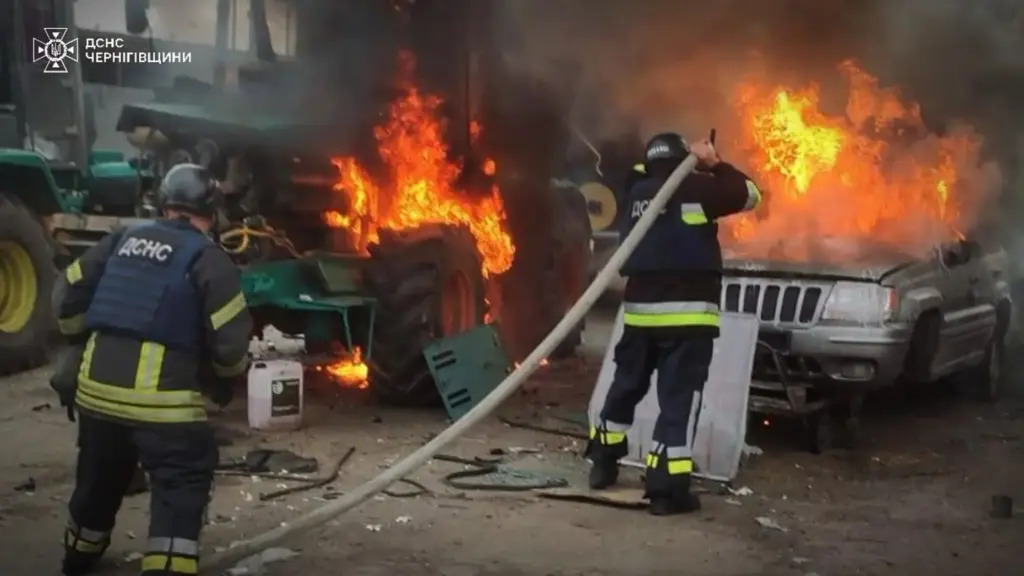 Emergency services personnel work to extinguish a fire following a Russian air attack.