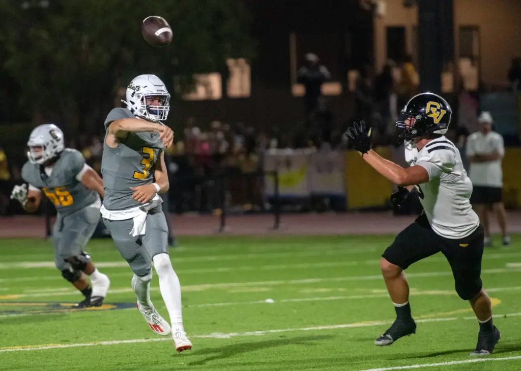 Crean Lutheran quarterback Caden Jones throws the ball while on...