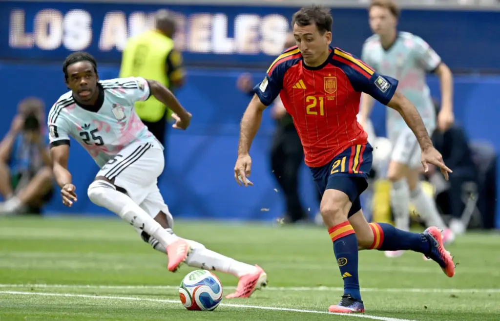 Spain forward Mikel Oyarzabal (21) moves the ball as Belgiumâs...