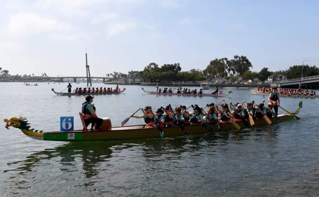 Teams maneuver to their racing position as others return from...