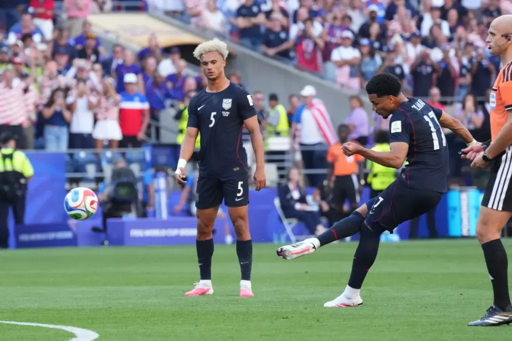 United States’ Malik Tillman (17) scores their opening goal against...