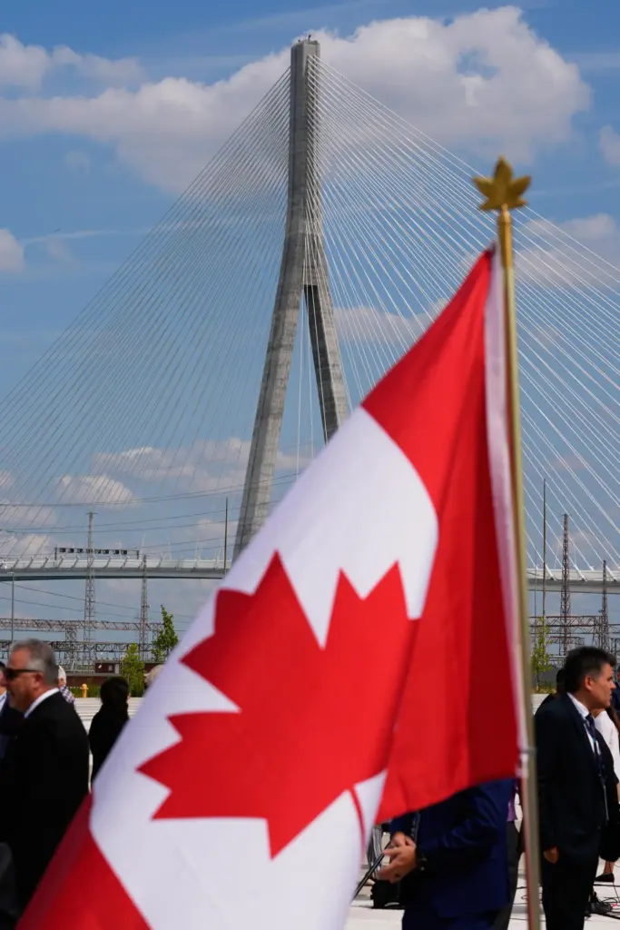 A Canadian flag is displayed during a celebration for the Gordie Howe International Bridge.