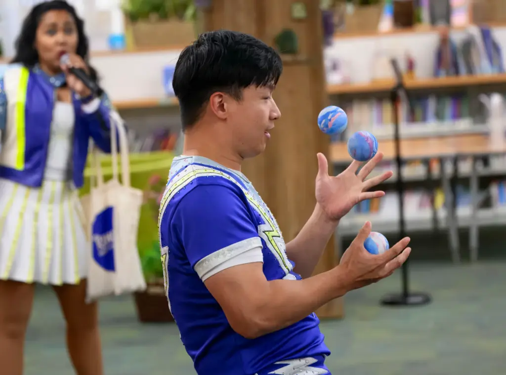 Chen Lei of the Ringling Hype Crew does a little...