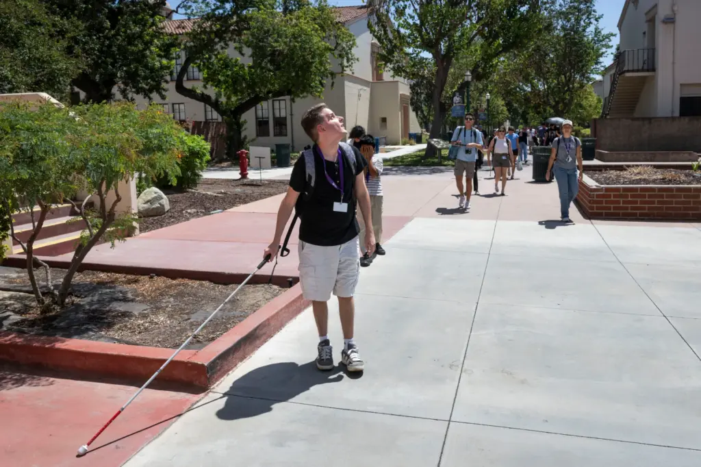 Intern and camper Brandon Reed leads a tour of Fullerton...