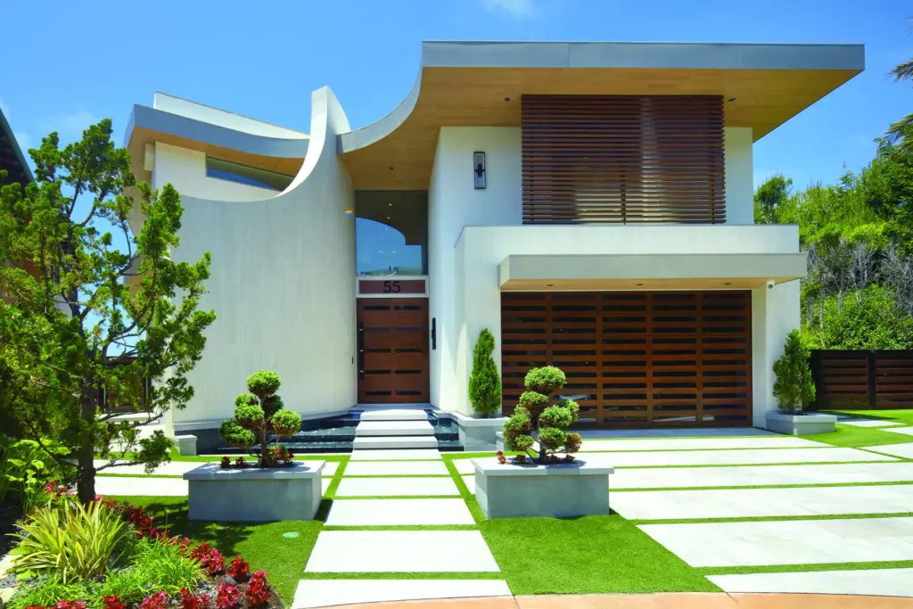 Geometric lines and a wave-inspired curved entryway define the exterior...