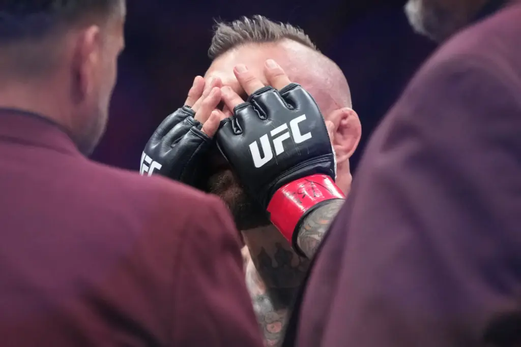 Conor McGregor reacts after losing to Max Holloway in a...