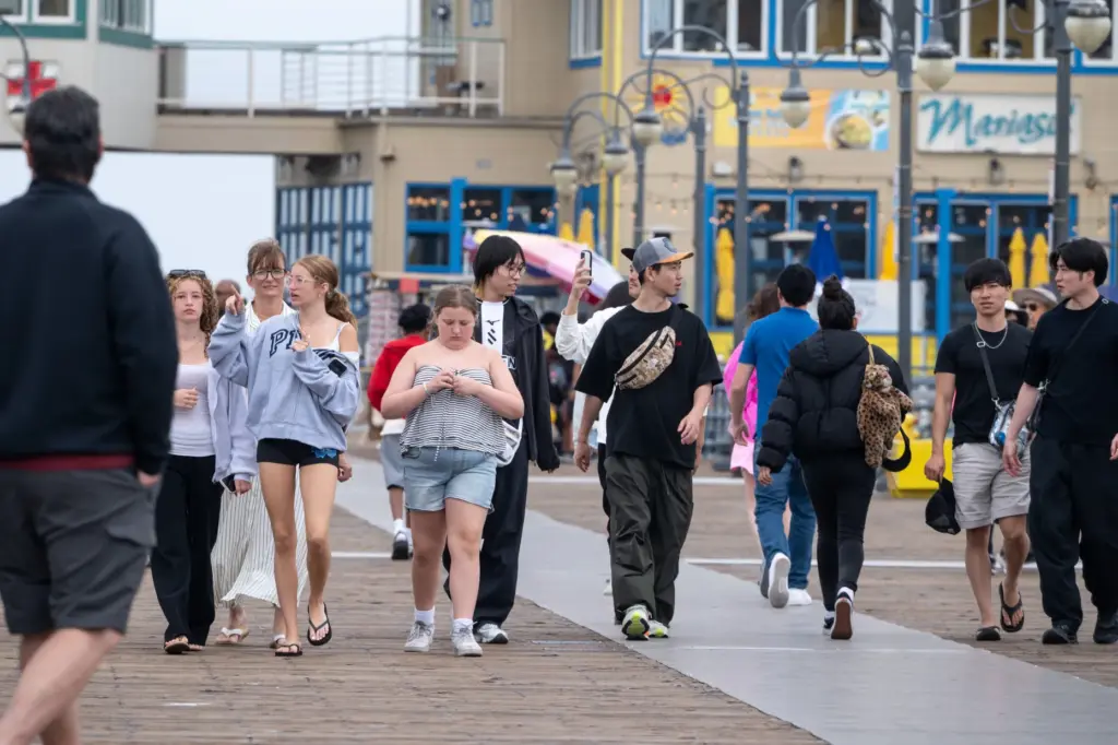 Visitors at the Santa Monica Pier enjoy mild temperatures on...