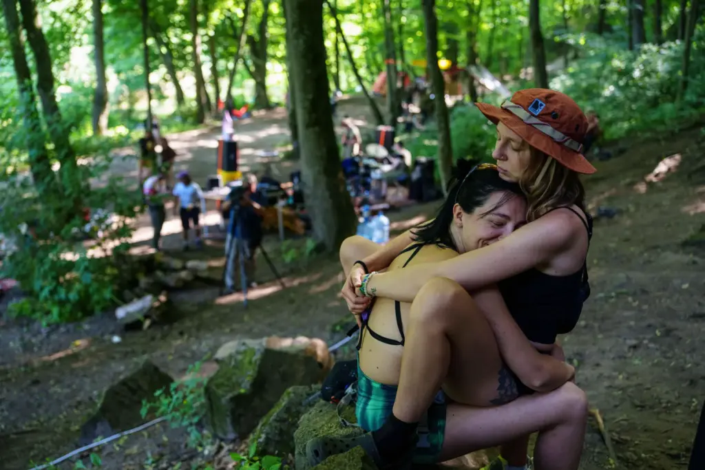 Women rest after climbing during the Stoned Climbers festival near...
