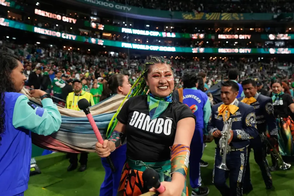 Artists perform before the start of the World Cup round...