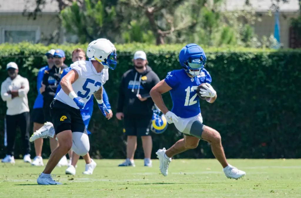 Los Angeles Rams wide receiver Puka Nacua attempts to evade...