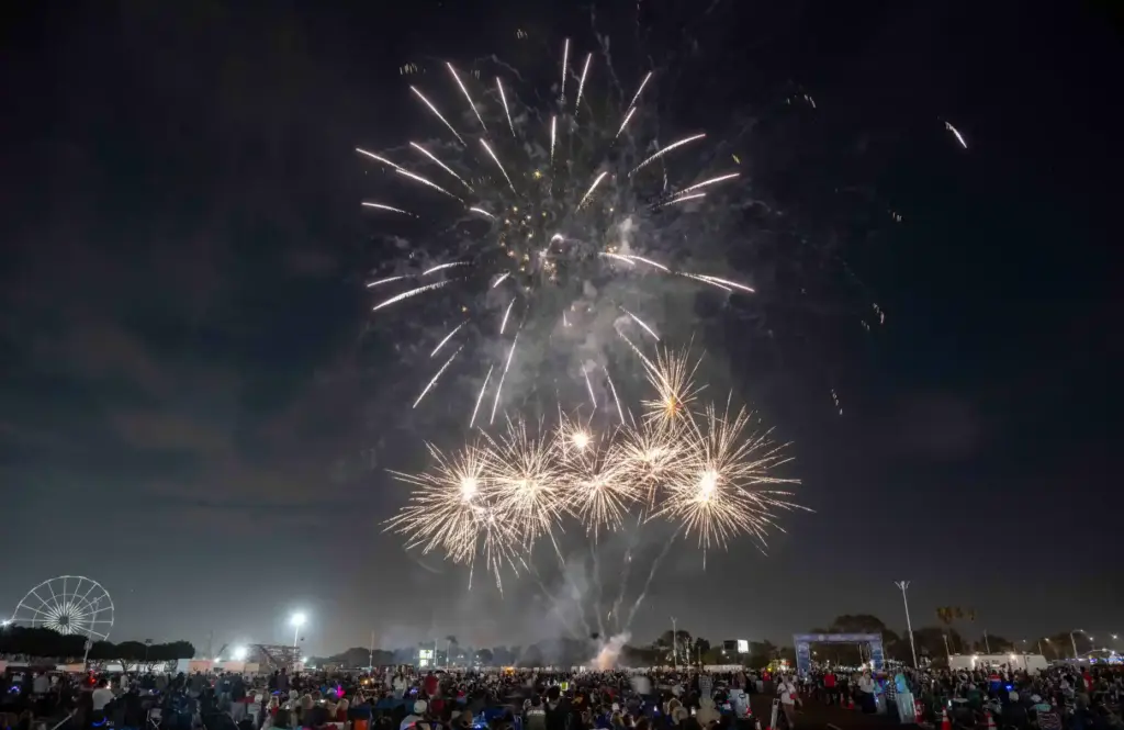 Fireworks explode over the OC Fair Event Center in Costa...
