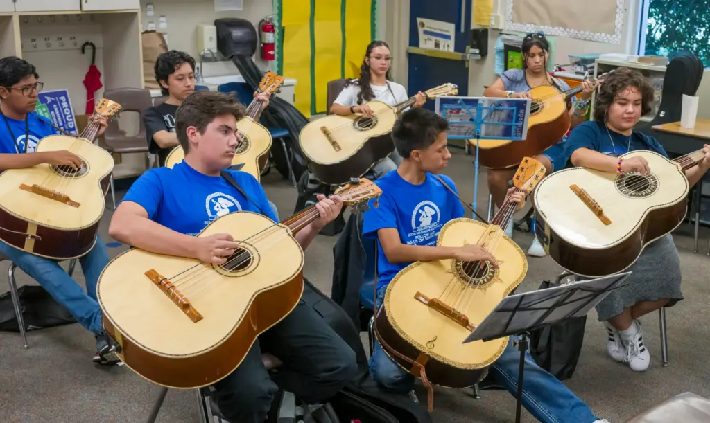 Students in the advanced guitarrÃ³n class practice during the 15th...