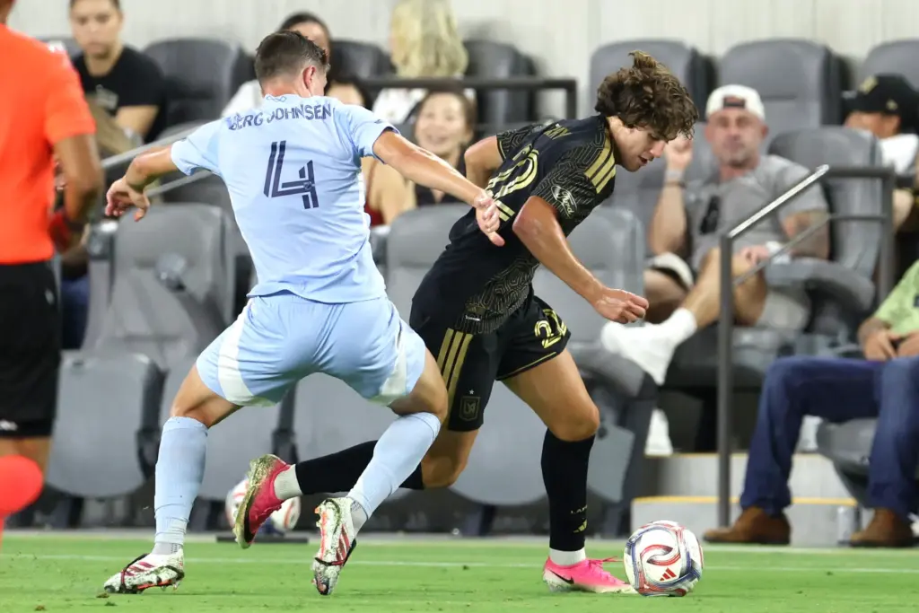 Los Angeles FC midfielder Jude Terry, right, controls the ball...