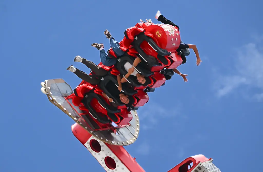 Fairgoers ride Titan during opening day at the OC Fair...