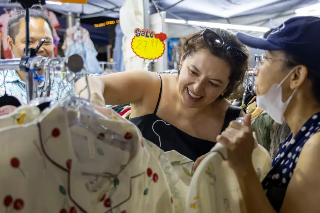 Jazmin Nguyen sifts through clothes during the Night Market on...