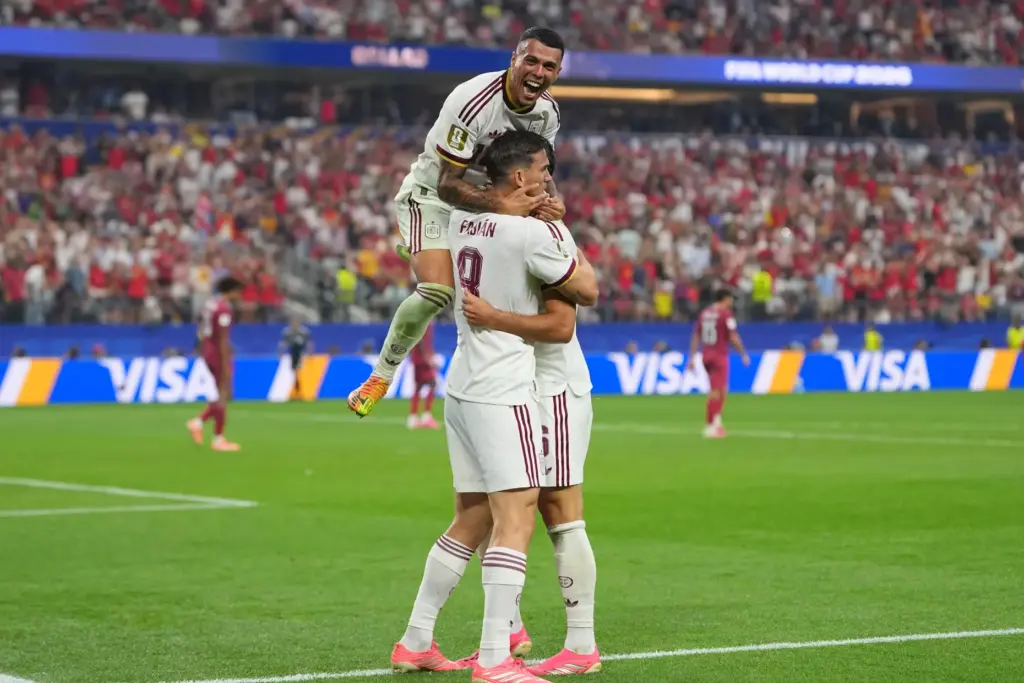Spain’s Pedro Porro, top, congrats Spain’s Mikel Merino, right, after...