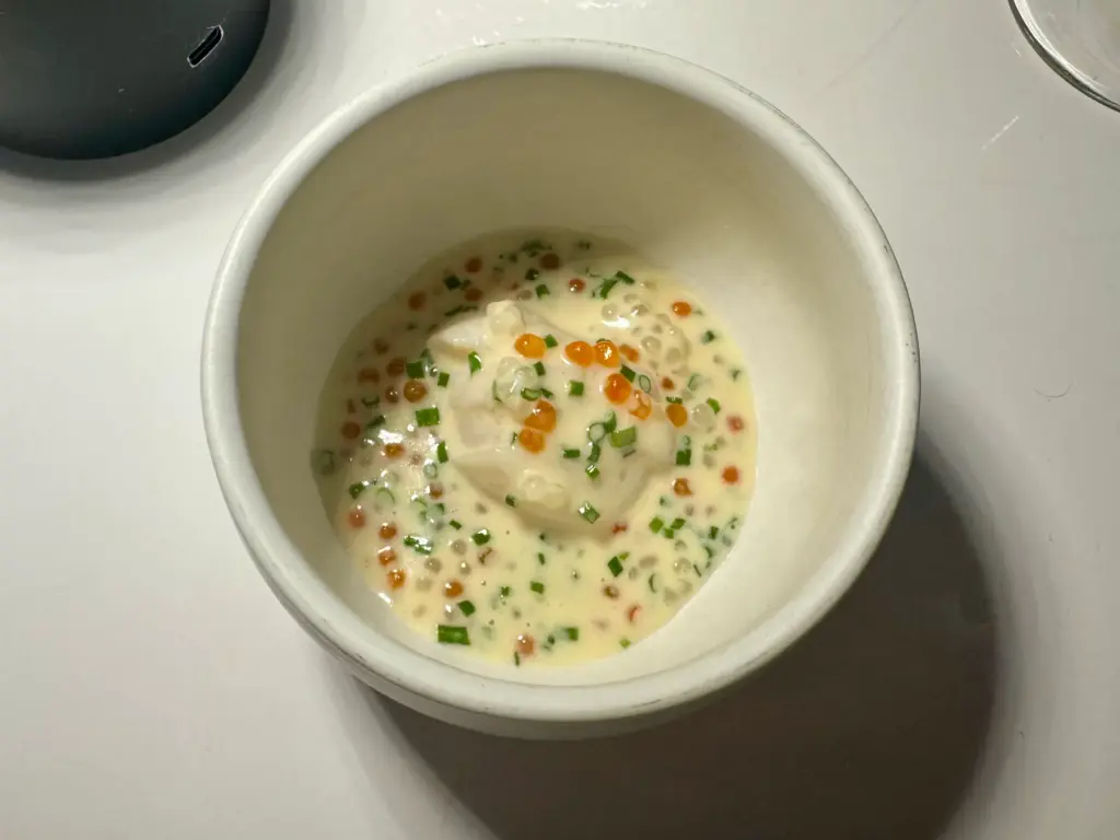 Poached scallop tapioca and smoked trout roe. (Photo by Brock...