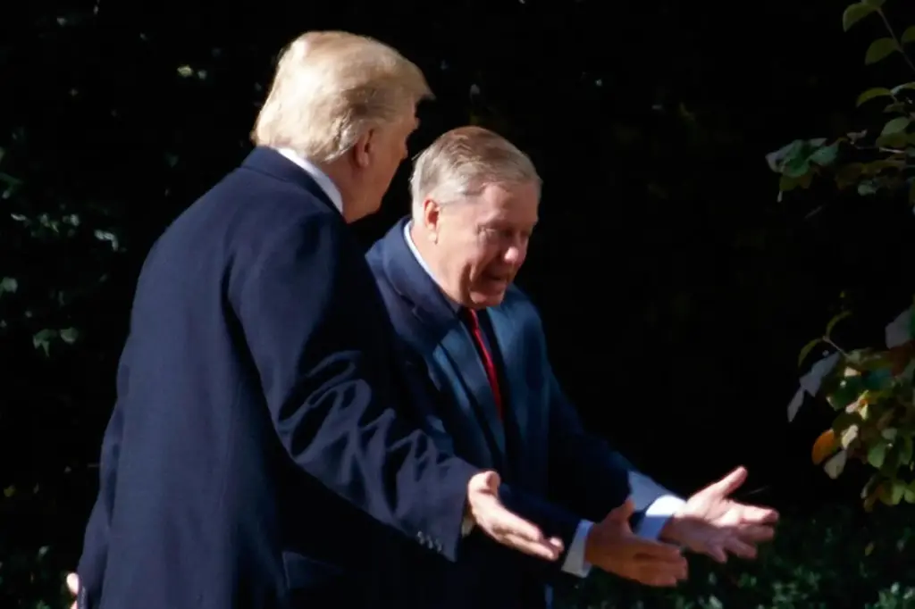 FILE – President Donald Trump walks to the Oval Office...