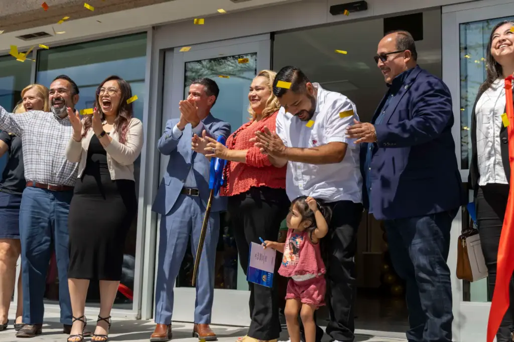 Santa Ana City Council members celebrate after cutting the ribbon...
