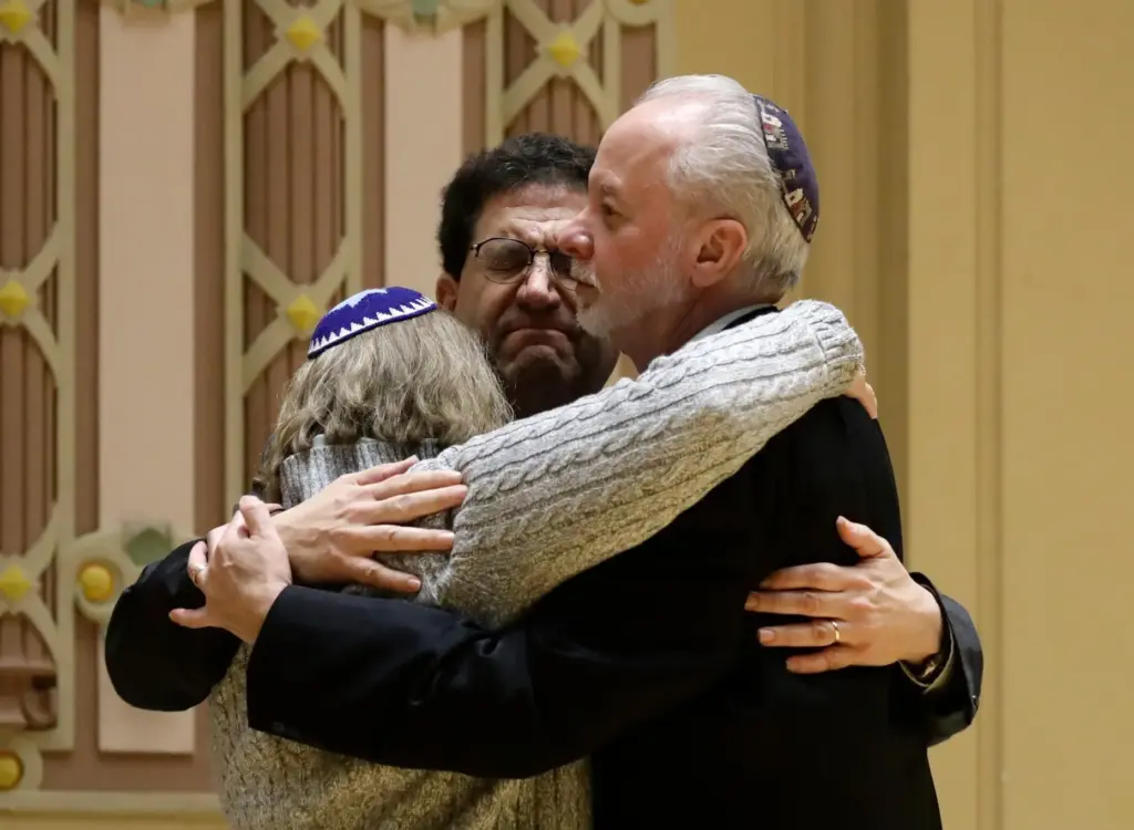 FILE – Rabbi Jeffrey Myers, right, of Tree of Life/Or...