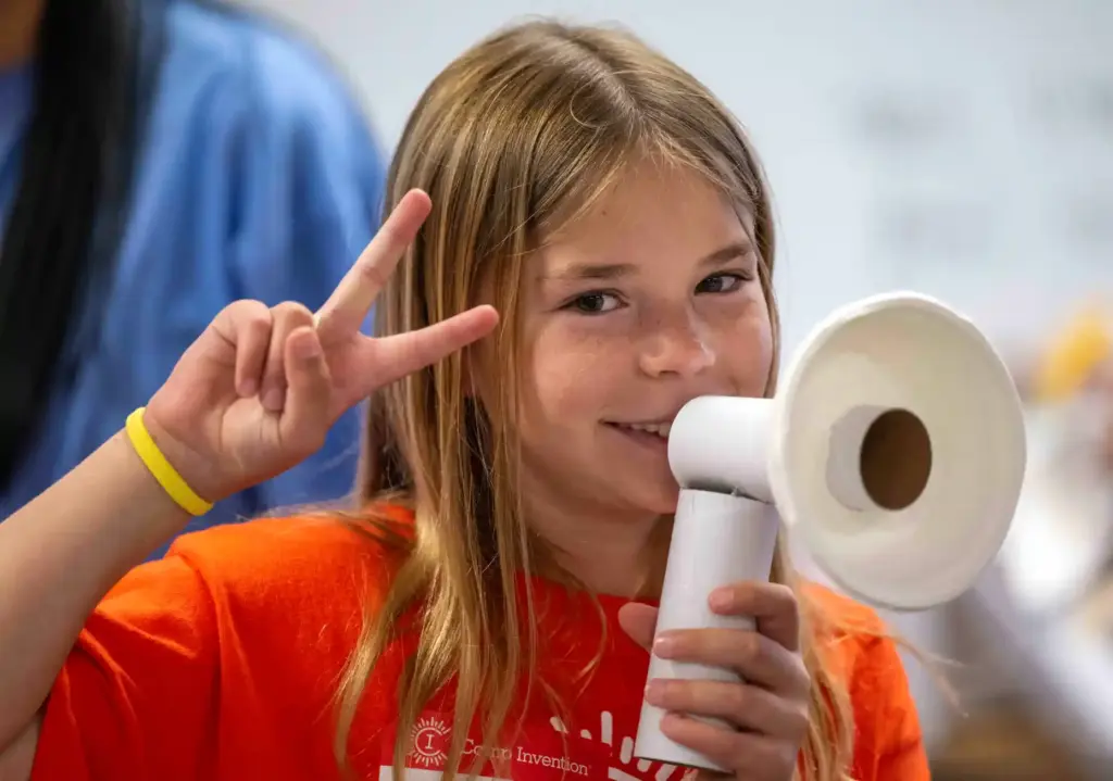 Kate Andrew, 9, of Ladera Ranch talks through a pretend...