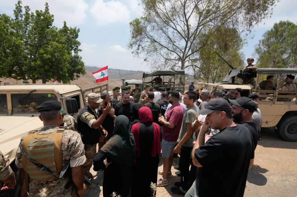 Lebanese army soldiers prevent residents from entering the southern village of Zawtar al-Gharbiyeh.