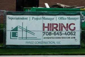 US filings for jobless aid fall to 215,000 as layoffs remain at historically healthy levels